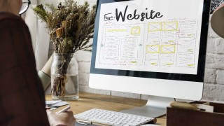 person working on website design using a computer