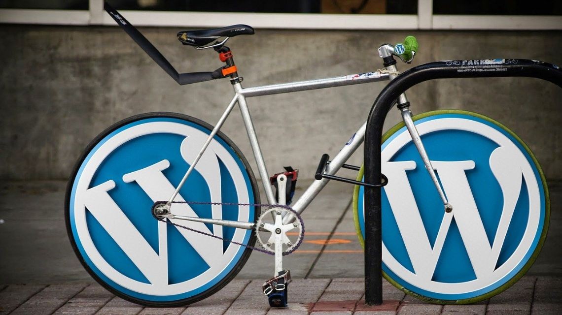 bike with wheels of the Wordpress logo